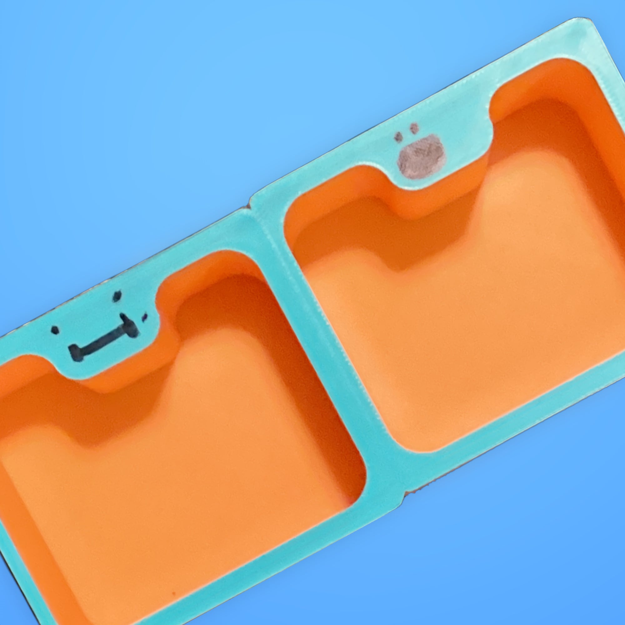 A young maker holding a Mini Deskbuddy organizer